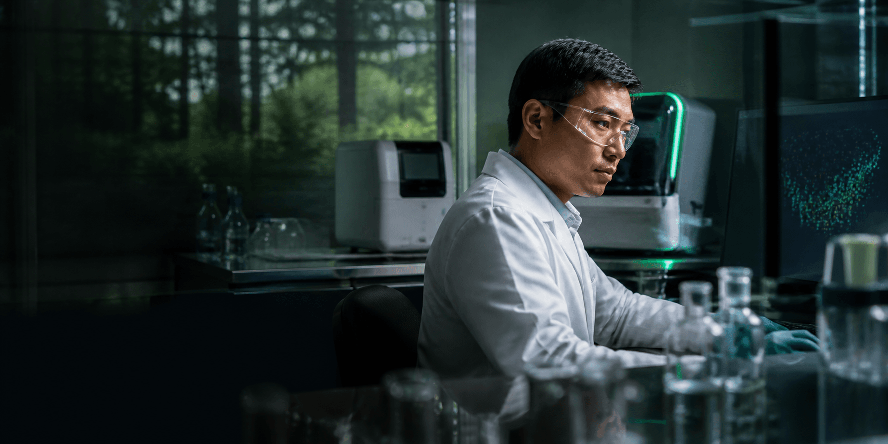 A life-science researcher working with genomic data in a modern laboratory